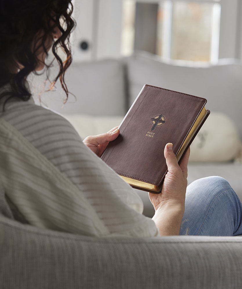 Woman reading a Catholic Bible